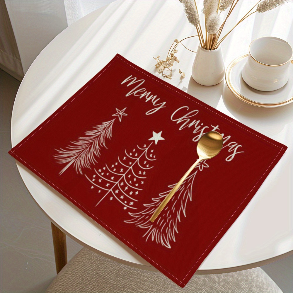 Linen Table Runner - ミニマルな赤い背景に白いシンプルなクリスマスツリーと「メリークリスマス」の文字が描かれた、リネン製のテーブルマット。ホリデーシーズンに最適なテーブルランナーとして。